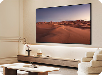 TV showing desert landscape on wooden console