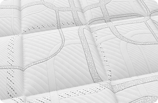 Close-up of quilted mattress surface with geometric stitched pattern