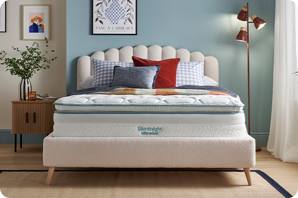 Silentnight UltraGel mattress on a cream upholstered bed in a modern bedroom