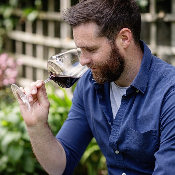 a man drinking from a glass